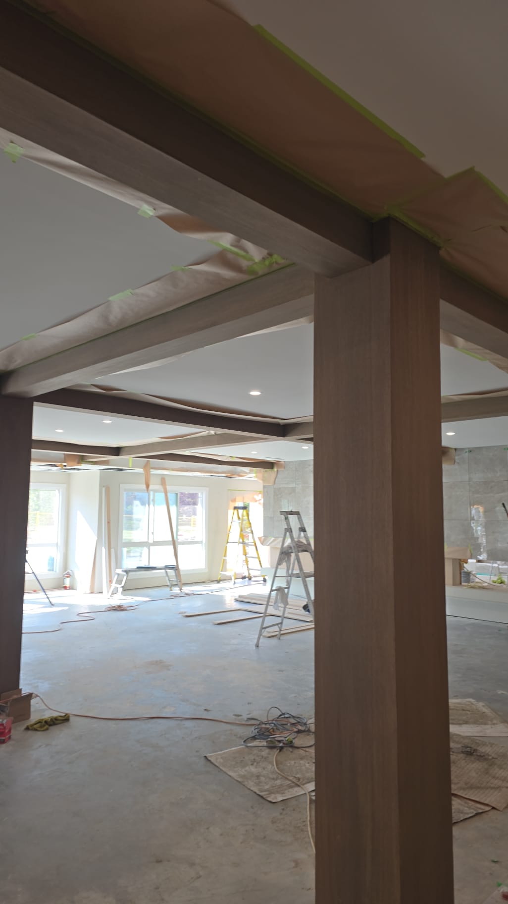 Wood beams masked with paper Edmonton commercial